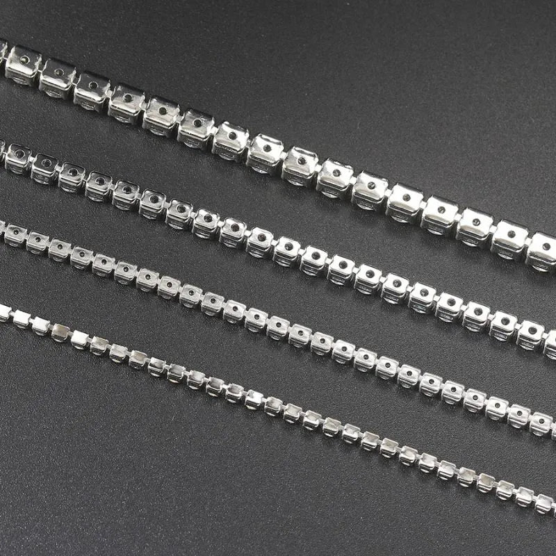 Luxury silver tennis bracelet for men with round cubic zirconia stones and secure fold-over clasp.