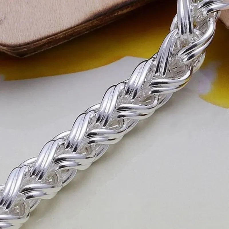 Detailed view of the Sovereign Wheat Chain Bracelet featuring an elegant woven chain pattern in sterling silver.