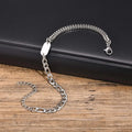 Insignia chain bracelet with ID tag on a dark leather background