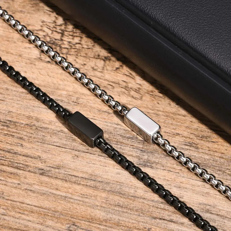 Silver and Black versions of the Customised Men's Bracelet – Kinship Box Chain Bracelet shown together.