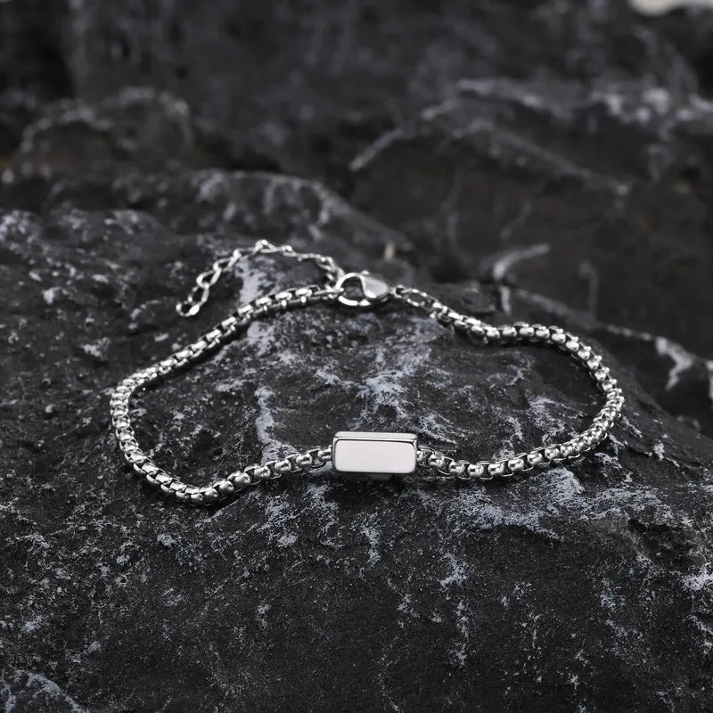 Customised Men's Bracelet – Kinship Box Chain Bracelet in the Silver finish, displayed on a dark stone surface.