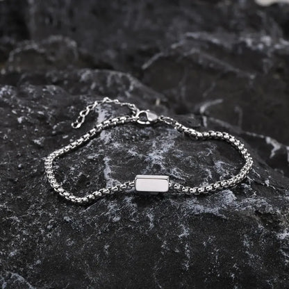 Customised Men's Bracelet – Kinship Box Chain Bracelet in the Silver finish, displayed on a dark stone surface.