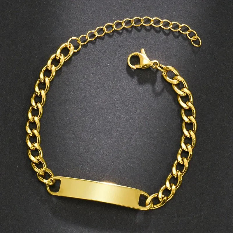 Blank gold nameplate bracelet with a curb chain and lobster clasp, ready for engraving