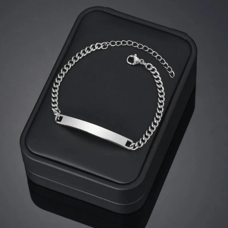 Gold engraved ID bracelet with stainless steel construction and timeless design.