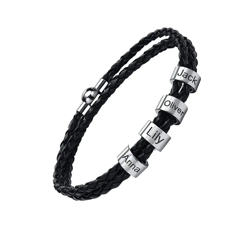 Lineage black braided leather bracelet with 4 engraved name plates, product photo on white background.