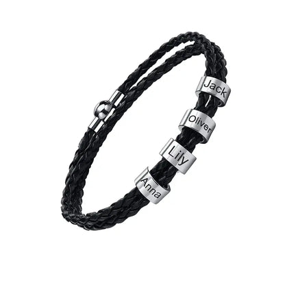 Lineage black braided leather bracelet with 4 engraved name plates, product photo on white background.