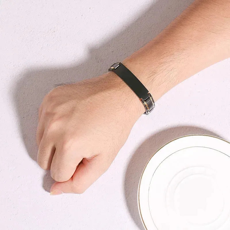 Man wearing the Customised Men's Bracelet – Marshal Line Watch-Band Bracelet in the Gold Line Black finish.
