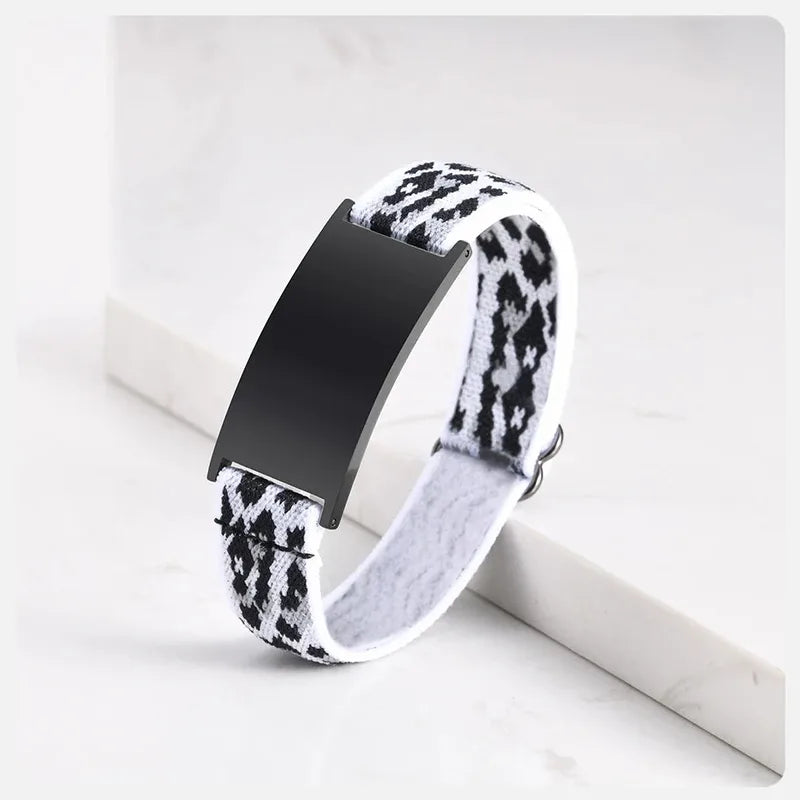 Pulse elastic ID bracelet in black and white houndstooth pattern with black-finish plate