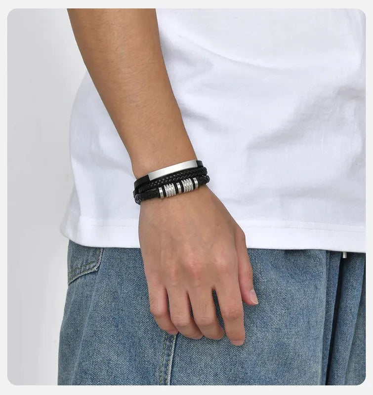 Man wearing the Customised Men's Bracelet – Vanguard Braided Leather Bracelet in the Silver finish.