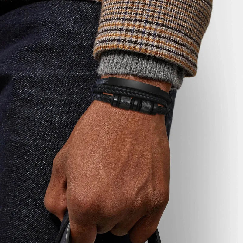 Man wearing the Customised Men's Bracelet – Vanguard Braided Leather Bracelet in the Black finish.