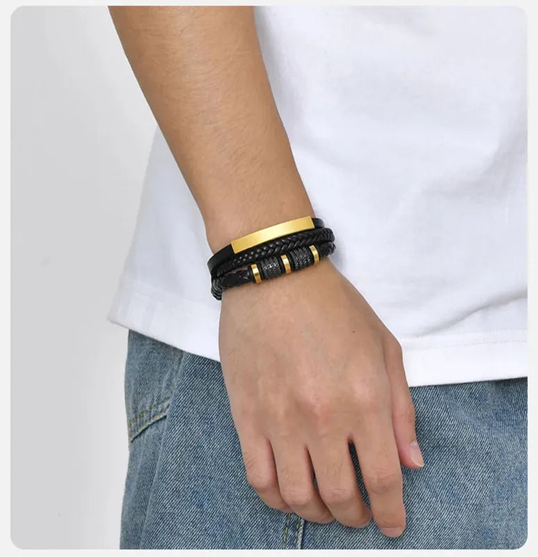 Man wearing the Customised Men's Bracelet – Vanguard Braided Leather Bracelet in the Gold finish.