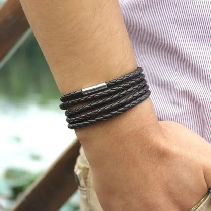 Black braided leather bracelet wrapped five times around the wrist