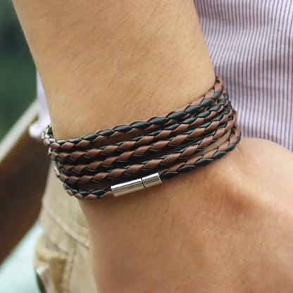 Brown and black two-tone braided leather bracelet wrapped five times around the wrist