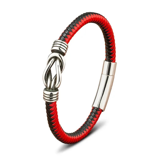 Red and black braided leather bracelet with a polished stainless steel infinity-knot clasp, on a white background