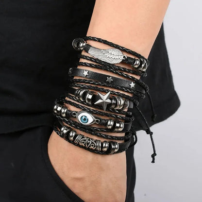 Five-piece evil eye leather bracelet stack worn on the wrist, paired with black clothing.
