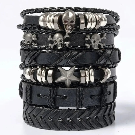 Six-piece black leather bracelet stack with a silver skull bead, skull-and-crossbones charms, and a star bead, on a white background.