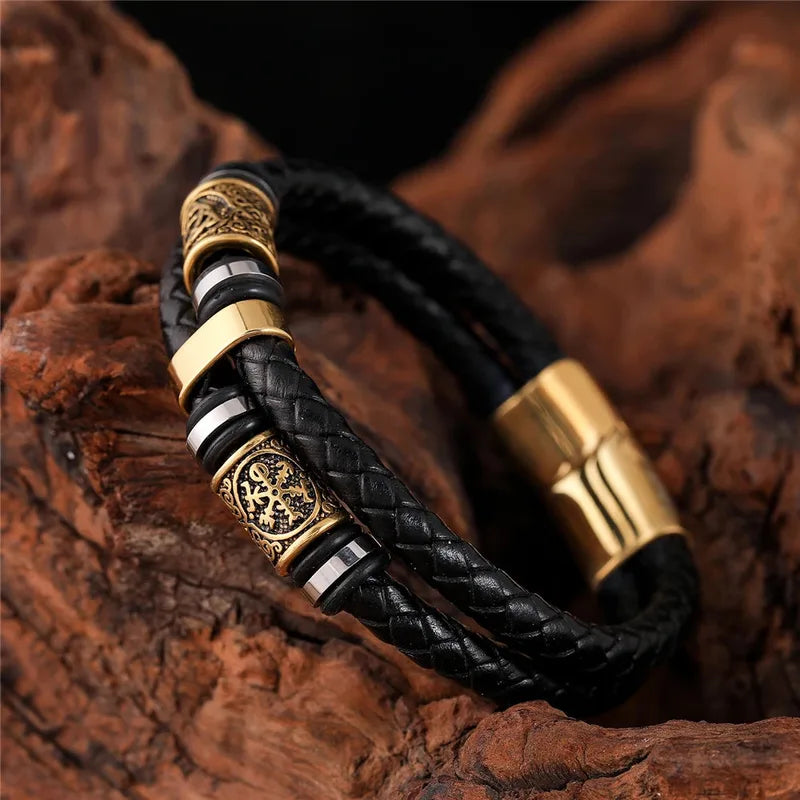 Black braided leather bracelet with gold-tone engraved Norse rune beads and a magnetic clasp