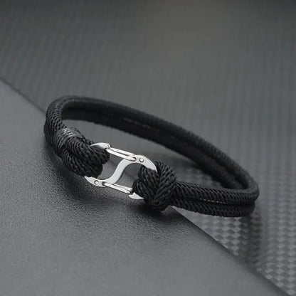 Black double-strand Milan cord bracelet with a polished stainless steel oval clasp