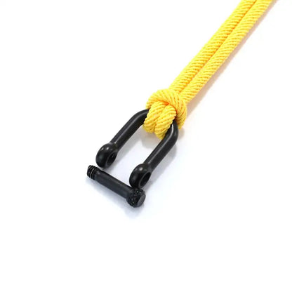 Close-up of the screw-pin shackle clasp on a yellow double-strand rope bracelet