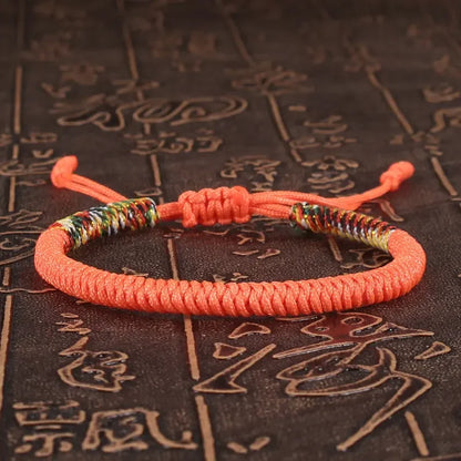 Orange braided cord bracelet hand-knotted with the King Kong knot