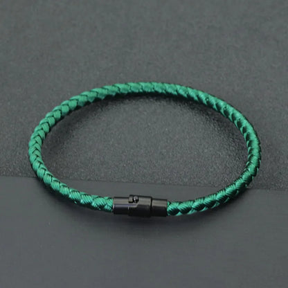 Green braided cord bracelet with a black stainless steel barrel clasp