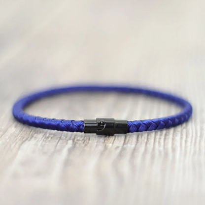 Dark blue braided cord bracelet with a black stainless steel barrel clasp