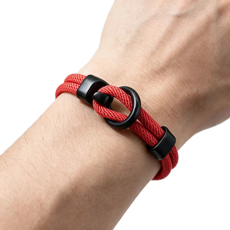 Moor Double-Loop Rope Bracelet, red braided rope with black clasp, worn on wrist