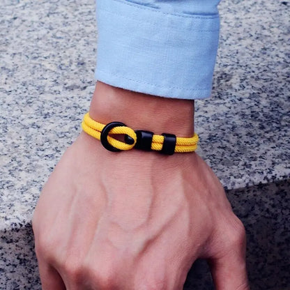 Yellow double-wrap rope bracelet worn on the wrist