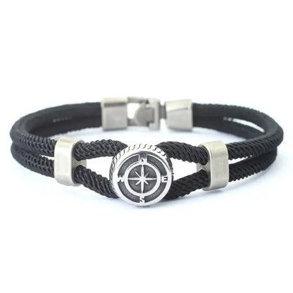 Black double-strand rope bracelet with a silver-tone compass charm