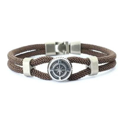 Brown double-strand rope bracelet with a silver-tone compass charm
