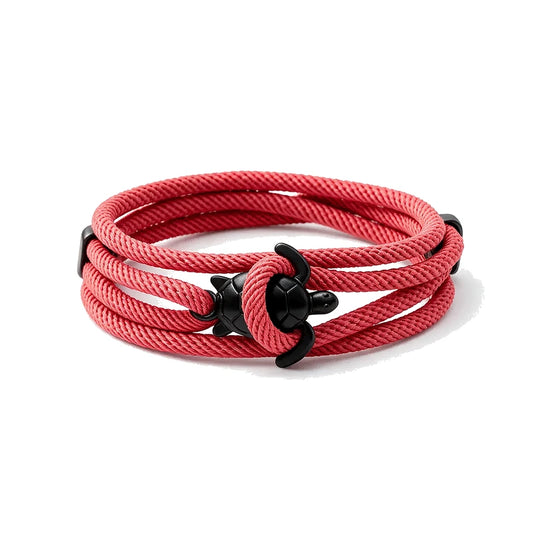 Reef Marine Charm Bracelet, red rope with black sea turtle charm, white background