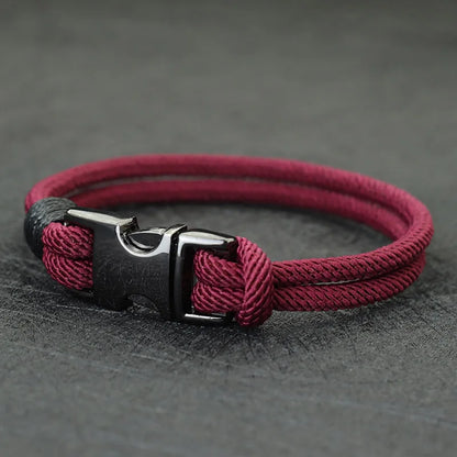 Wine-colored double-strand rope bracelet with a gunmetal spring-loaded buckle clasp