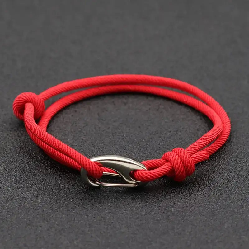 Red nylon rope bracelet double-wrapped with a curved metal hook clasp