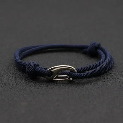 Navy nylon rope bracelet double-wrapped with a curved metal hook clasp