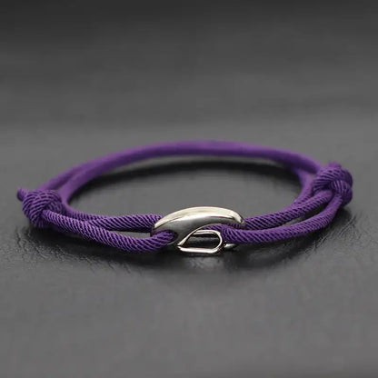 Purple nylon rope bracelet double-wrapped with a curved metal hook clasp