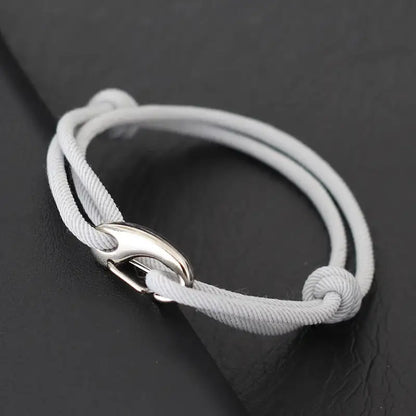 Silver grey nylon rope bracelet double-wrapped with a curved metal hook clasp
