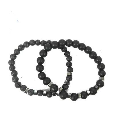 Close-up of lava stone and matte black onyx beads with cube-cut hematite spacers