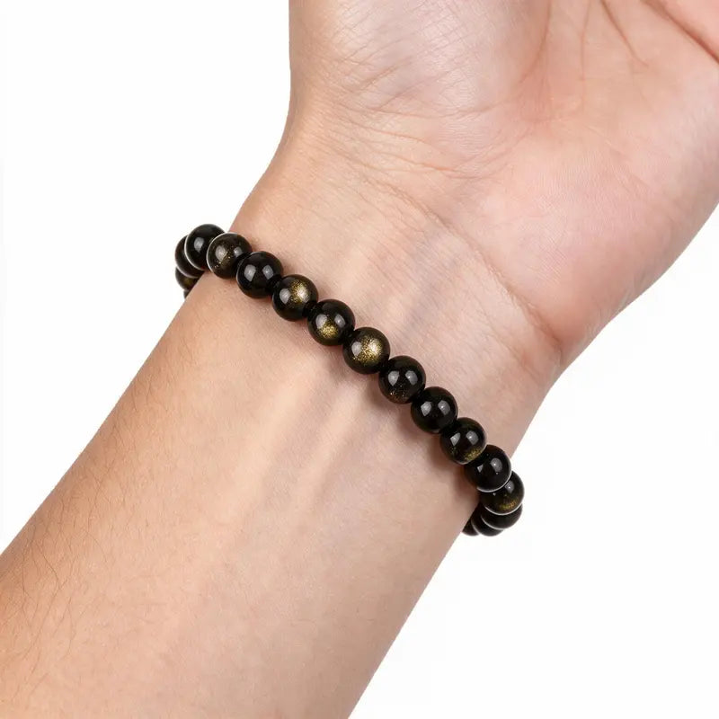 Eclipse Golden Obsidian Bead Bracelet worn on wrist