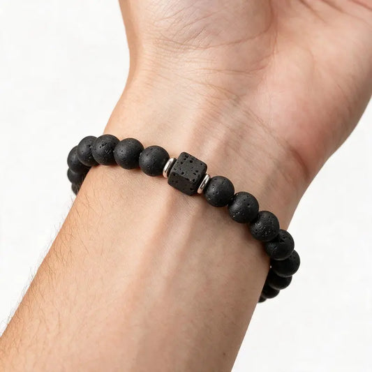 Ember Lava Diffuser Bead Bracelet worn on wrist, lava stone with silver spacer cubes