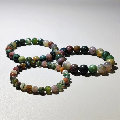 Indian agate bead bracelets coiled together, multicolor natural stone detail