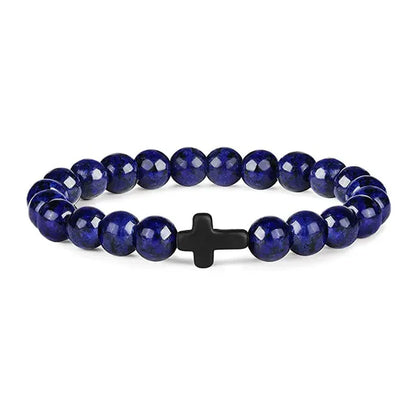 Blue lapis bead bracelet with a small black cross bead