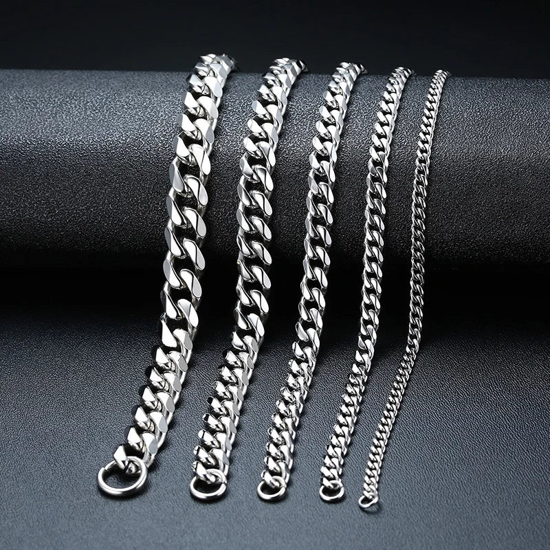 Silver Cuban link chains in five widths compared on a dark display stand