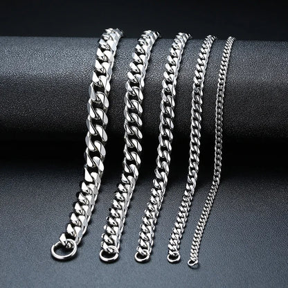 Silver Cuban link chains in five widths compared on a dark display stand