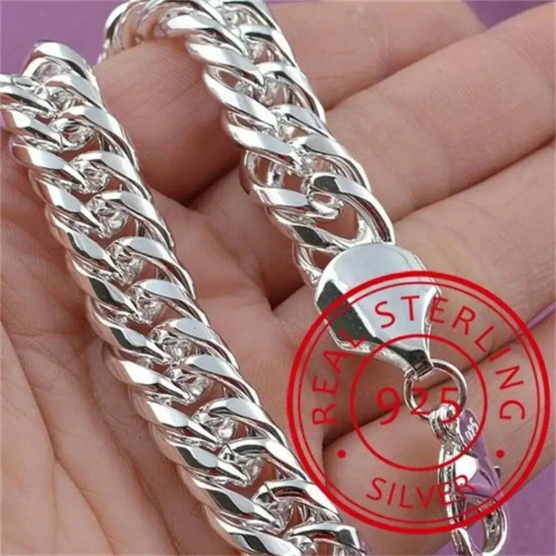 925 sterling silver thick double-row Cuban curb chain bracelet held in hand