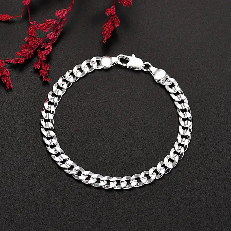 925 sterling silver diamond-cut flat curb chain bracelet with a lobster clasp
