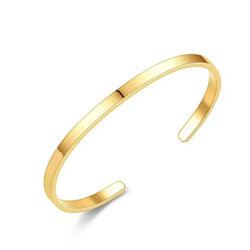 Gold open cuff bracelet, flat bar bent into an adjustable open shape