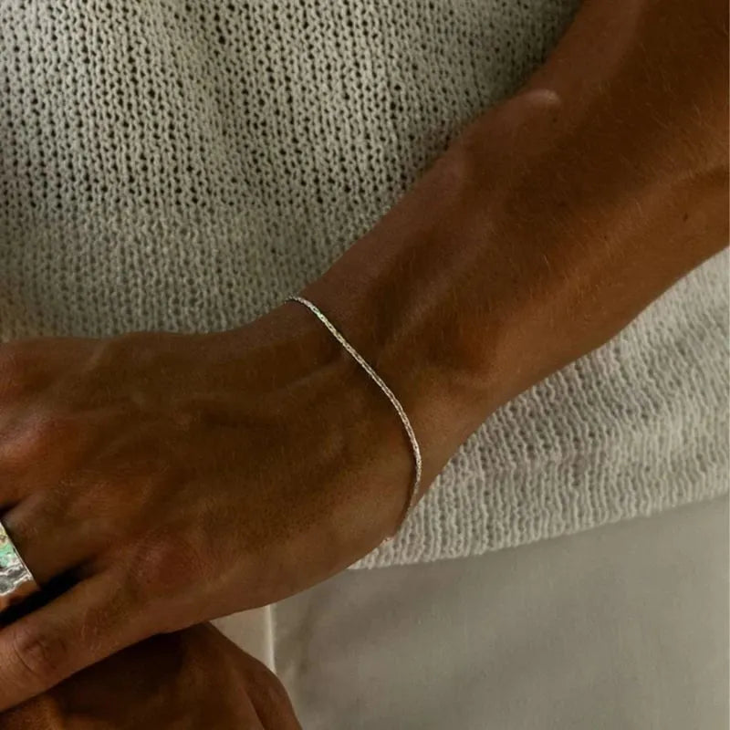 Minimalist gold hammered wire bracelet designed for lightweight comfort and everyday elegance.