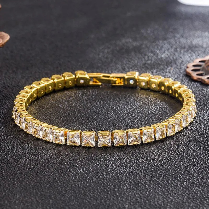 Elegant gold tennis bracelet with brilliant prong-set cubic zirconia for timeless men's style.