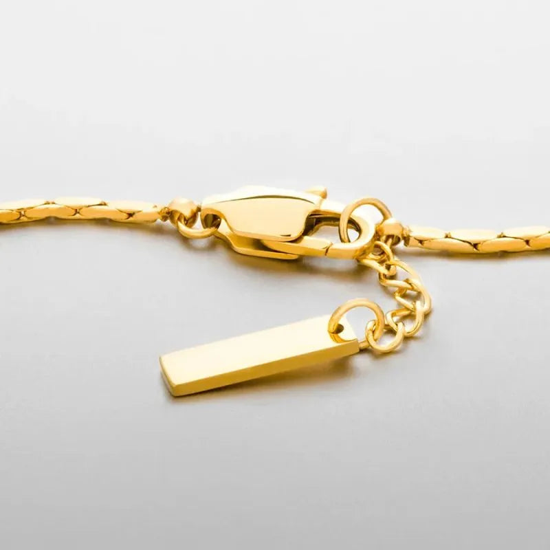 Men's Bracelet Gold with a lightweight 1.3 mm wire chain and polished stainless steel construction.