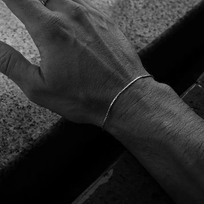 Luxury gold chain bracelet featuring an ultra-thin wire design for sophisticated everyday styling.